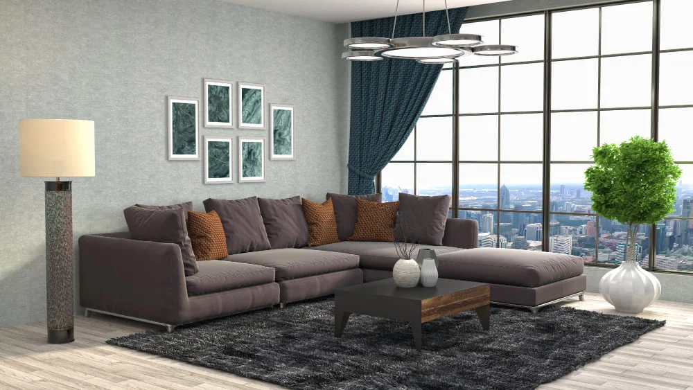 A spacious living room featuring a large sectional couch and a stylish coffee table at the center.