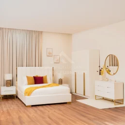 Elegant white bedroom set with gold accents.