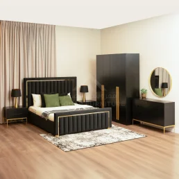 Luxurious black bedroom set with gold accents, featuring an upholstered bed, nightstands, wardrobe, and dresser with a round mirror.